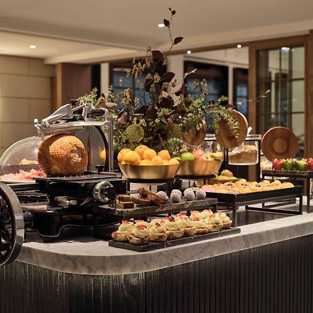 Hilton Melbourne Little Queen Street Exterior photo A buffet at a hotel